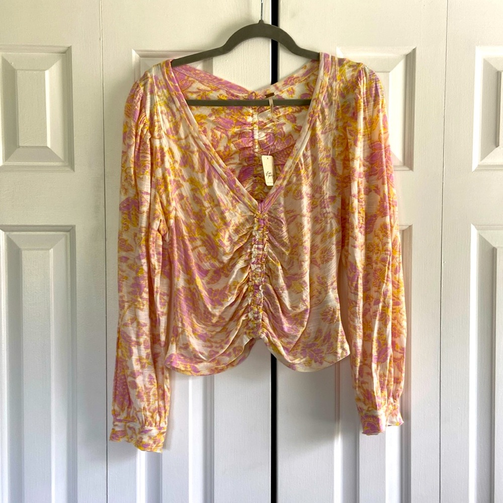 Free people top. Size large. Never been worn with tags!
